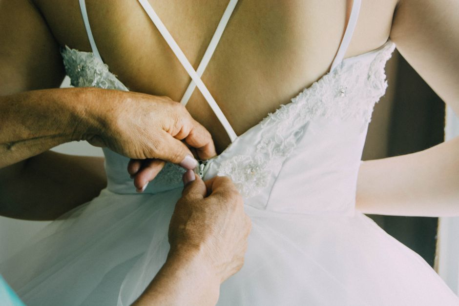Bride getting ready in her wedding dress